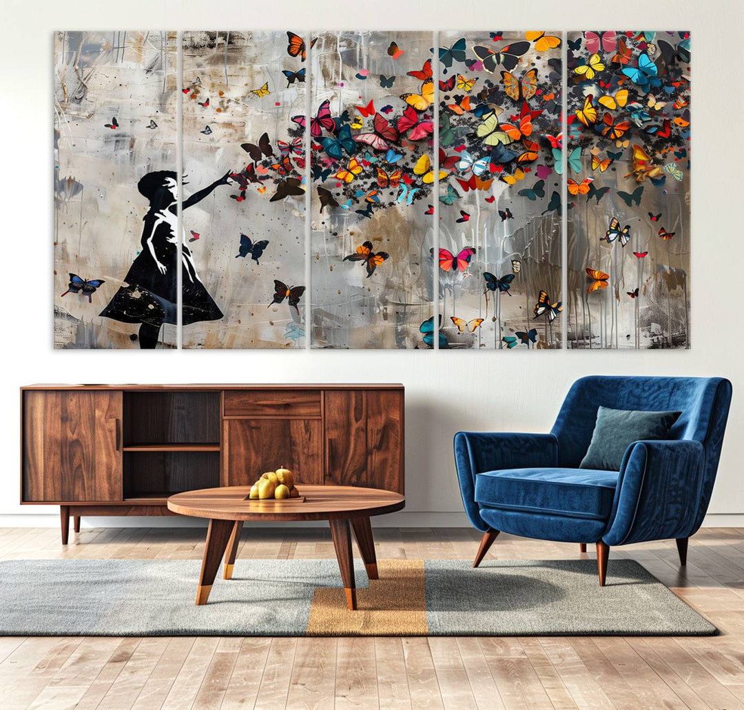 The Banksy Butterfly Girl 3-Piece Modern Graffiti Canvas Wall Art features a silhouette of a girl reaching for butterflies.