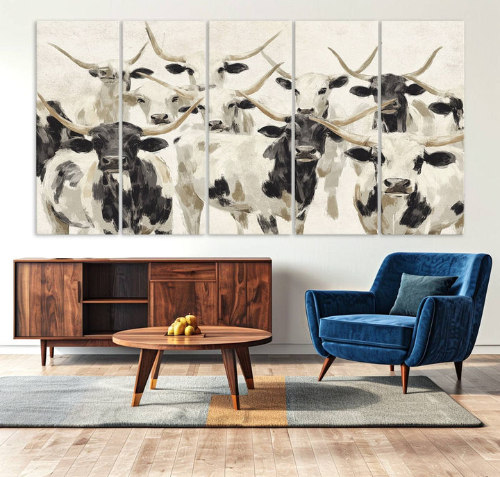 Canvas print titled Longhorn Texas Cow Drawing, depicting longhorn cattle with black and white markings, made in the USA, displayed on the wall.