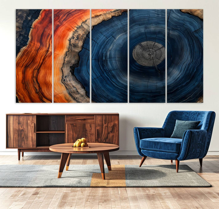 Abstract Tree Ring Wall Art Print on canvas featuring vibrant blue, orange, and brown rings with a natural rustic wood texture. Free shipping available!.