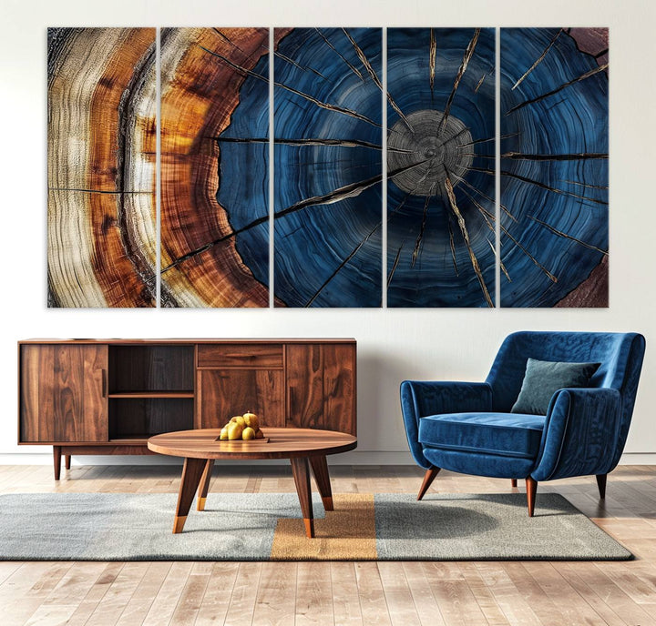 The Abstract Tree Rings Canvas Print features blue, brown, and orange rings that highlight wood grain and natures beauty.