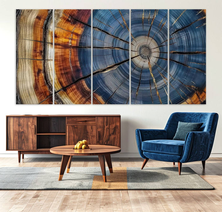 Close-up of blue, brown, and orange wood grain rings on the Abstract Tree Rings Canvas Wall Art Print.