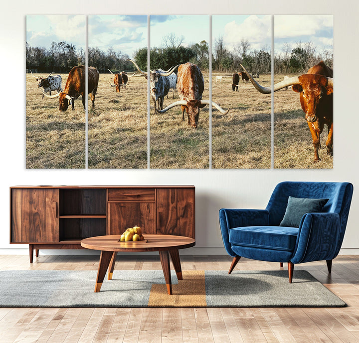 A herd of Texas Longhorn cattle grazing in an open field under a partly cloudy sky, capturing a rustic and Western ranch aesthetic.