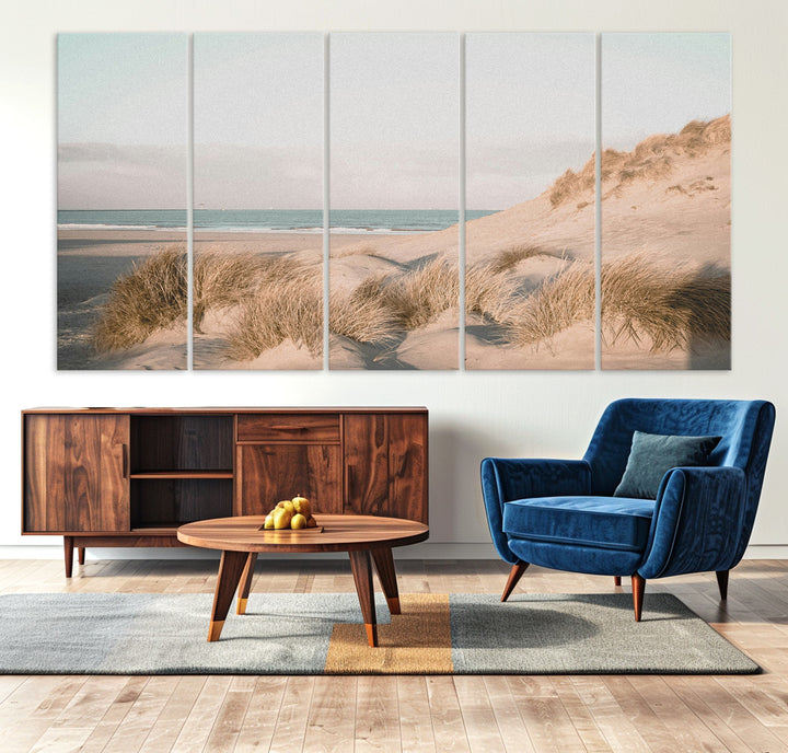 Soft pastel-toned beach scene with sand dunes, windswept grasses, and a calm ocean horizon, creating a serene coastal atmosphere.