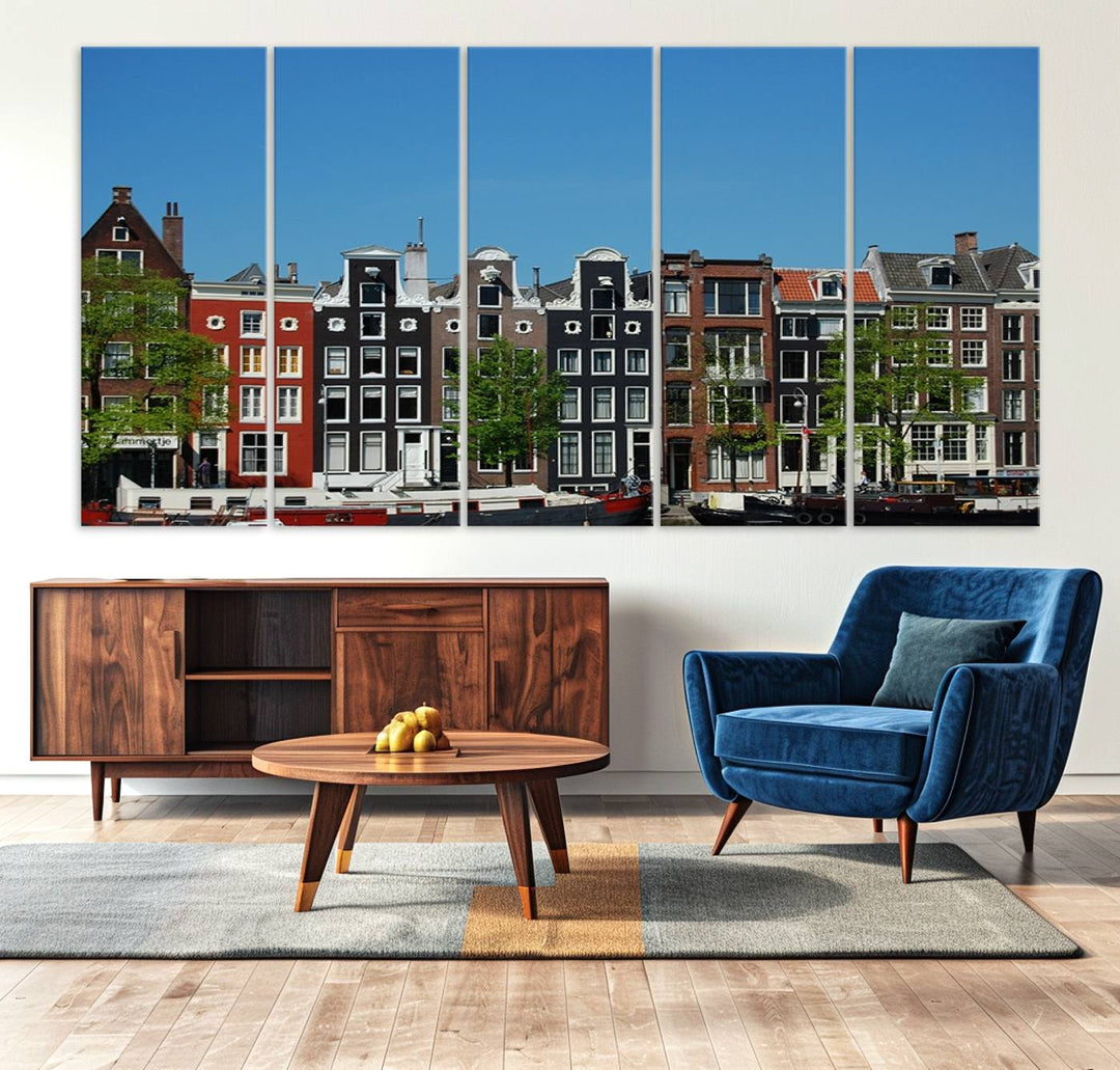 The Amsterdam City Wall Art Canvas Print showcases colorful traditional canal houses and boats set against a clear blue sky.