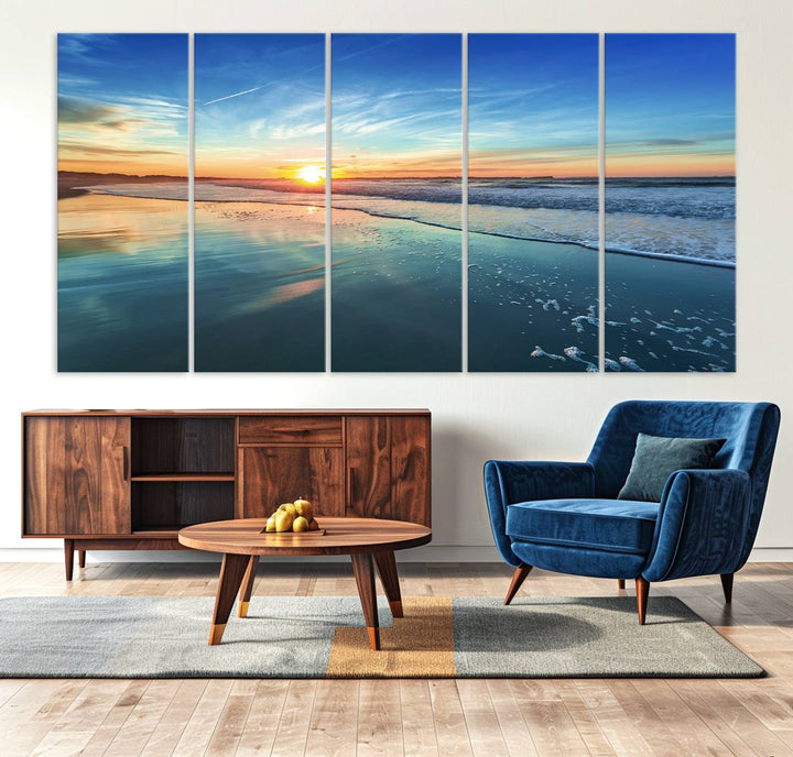 The Blue Sky and Beach Wall Art Canvas Print features a vibrant orange sky reflecting on wet sand.