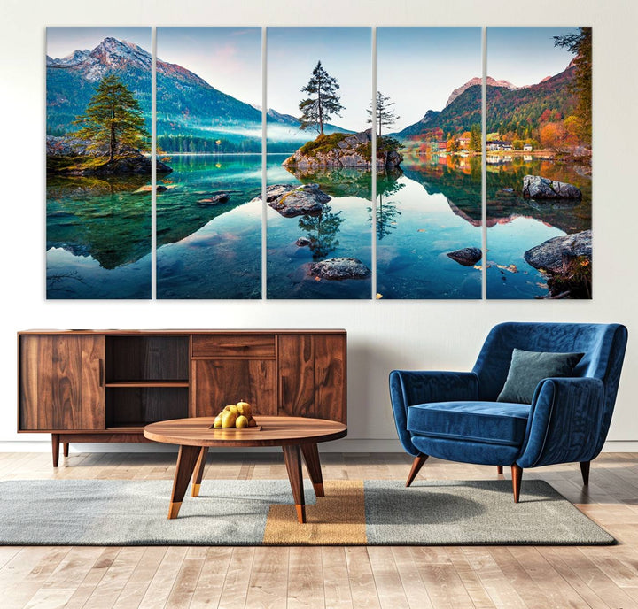 The 3-panel wall art showcases a serene mountain lake with rocky islands and trees, creating an ideal focal point for dining rooms or offices.