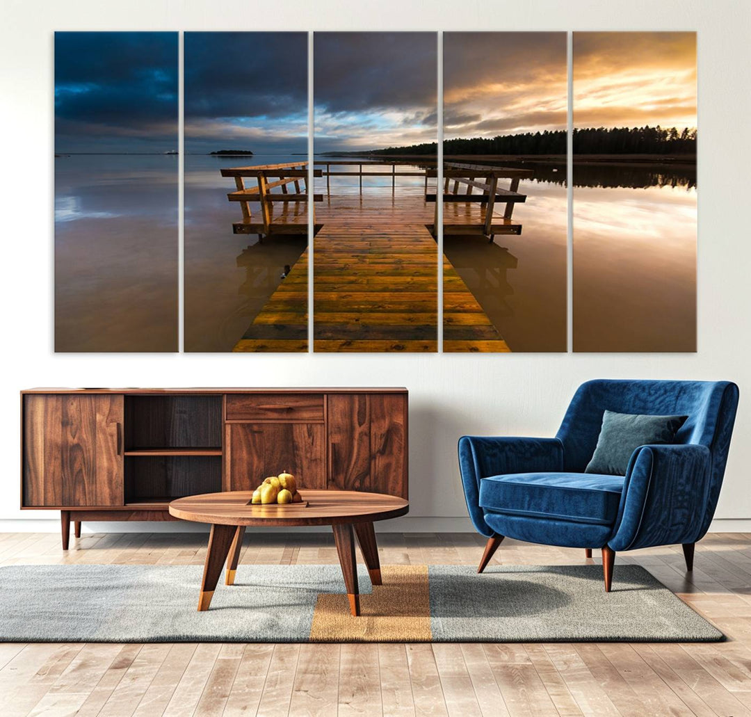 The "Serene Lake Pier at Sunset" landscape canvas print, crafted as ready-to-hang and framed wall art, enriches the contemporary setting by capturing the tranquility of a lakeside pier at sunset.