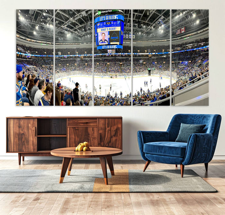 Wall art prints depicting the bustling scenes of the St. Louis Blues being cheered on by a full house at the Enterprise Center, beneath a large scoreboard.