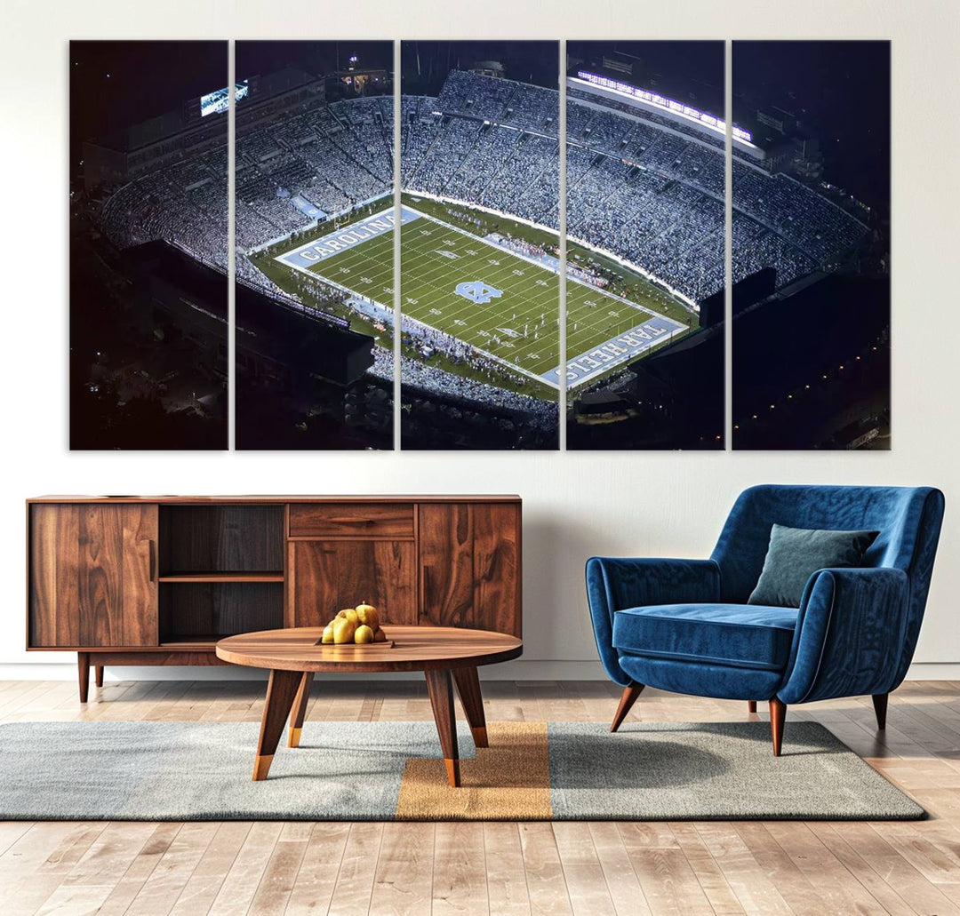 A University of North Carolina Tar Heels Football Team Print, showcasing Chapel Hill's Kenan Memorial Stadium, hangs in a modern dining room, adding a gallery-quality finish that enhances the entire space.