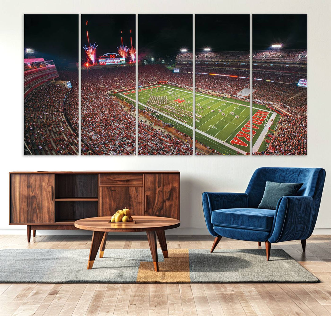 The University of Nebraska Cornhuskers Football Team Print, featuring Lincoln Memorial Stadium in a vibrant triptych canvas with fireworks above and a gallery-quality finish, is elegantly displayed.