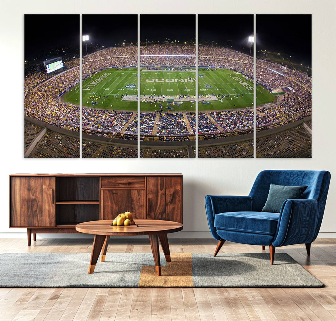 A large football stadium at night, featuring the UCONN Huskies, is depicted on the East Hartford Pratt & Whitney Stadium Wall Art Canvas Print.