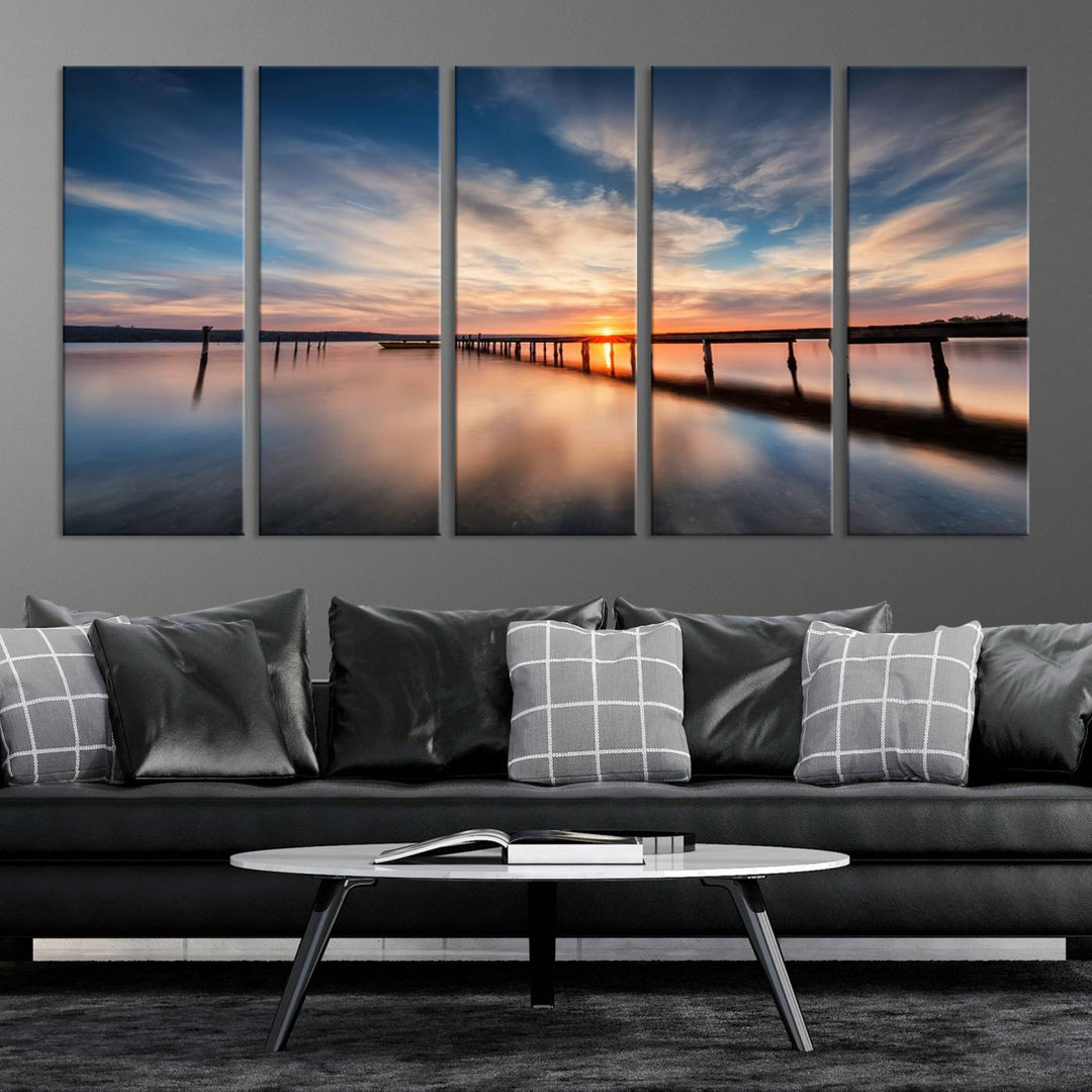 The Sunset Pier Canvas features a serene coastal landscape with vibrant hues under cloudy skies, ideal for modern decor.