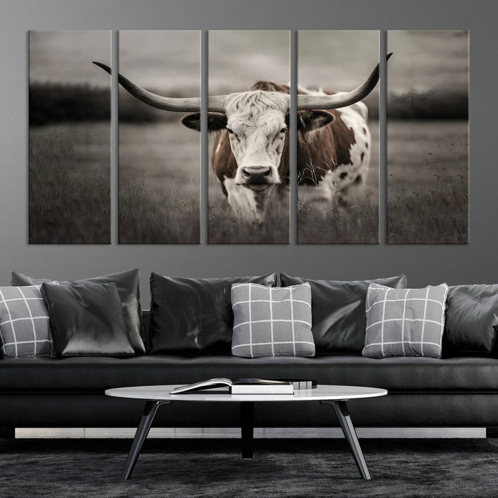 The Texas Longhorn Cow Canvas Wall Art Print adds a rustic touch to a living room.