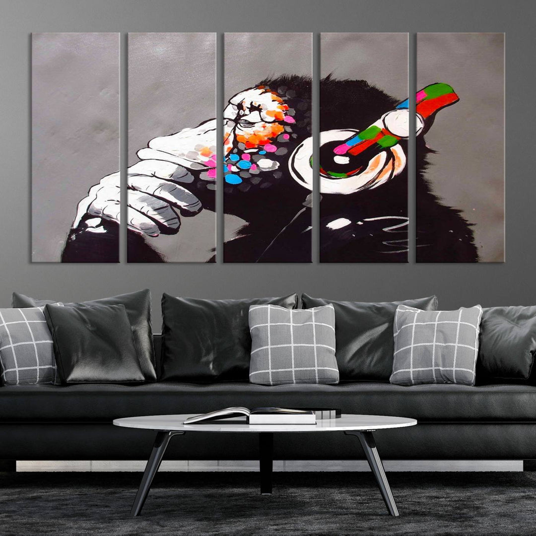 A vibrant triptych, the "DJ Monkey Listening to Music" wall art print, features a Banksy-inspired large canvas adorned with colorful modern pop art. This striking piece elegantly enhances the room with its dynamic and lively depiction.