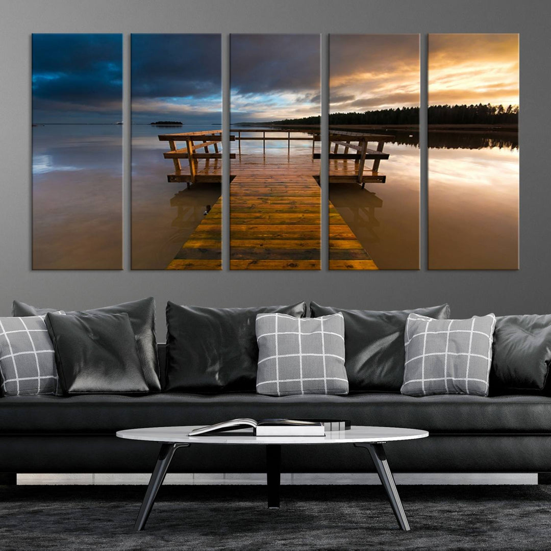 The "Serene Lake Pier at Sunset" landscape canvas print, crafted as ready-to-hang and framed wall art, enriches the contemporary setting by capturing the tranquility of a lakeside pier at sunset.