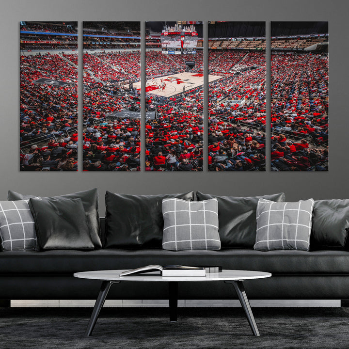 A painting of Louisville Cardinals fans in red at the KFC Yum Center Arena.