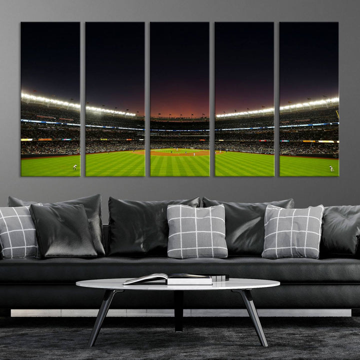 A night game at Yankee Stadium depicted on canvas beneath a sunset sky.