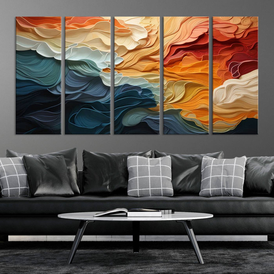 A Blue Orange Abstract Wave Wall Art Canvas Print adorns the wall. This colorful masterpiece is professionally hand-assembled to enhance any space.