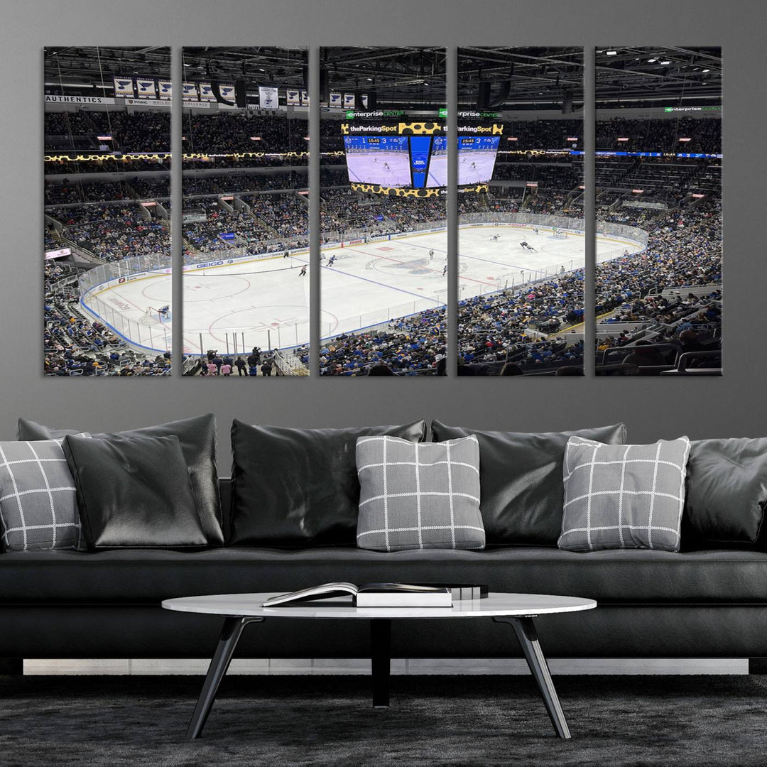 A large Enterprise Center canvas of a crowded hockey arena hangs prominently.