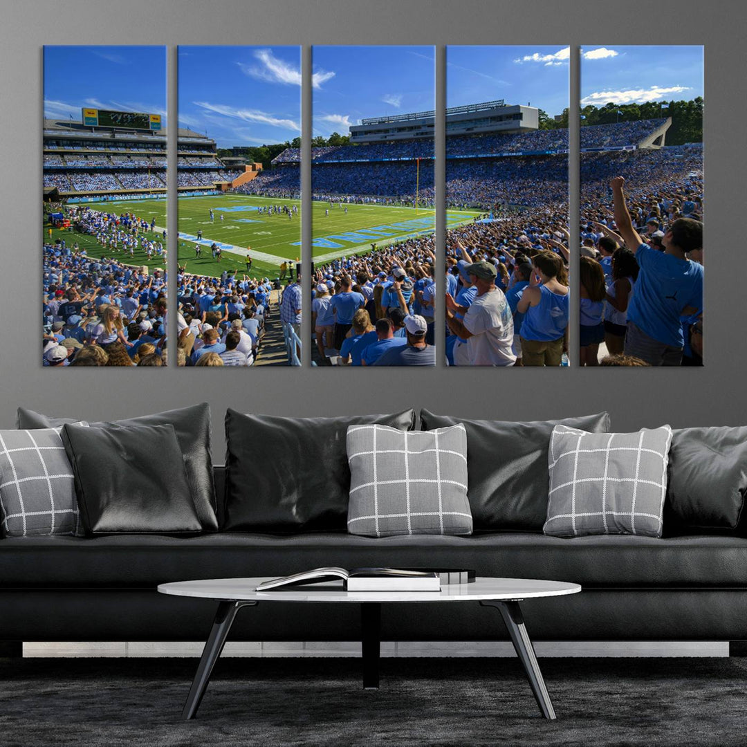 A gallery-quality canvas wall art print featuring the University of North Carolina Tar Heels Football Team and Chapel Hill's Kenan Memorial Stadium adorns the cafe wall.