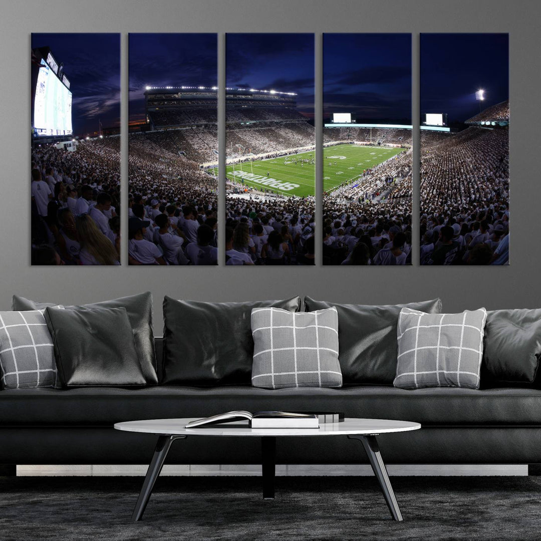 A packed football stadium at night, with bright lights and fans in white, depicted in a Michigan State Spartans Stadium wall art.