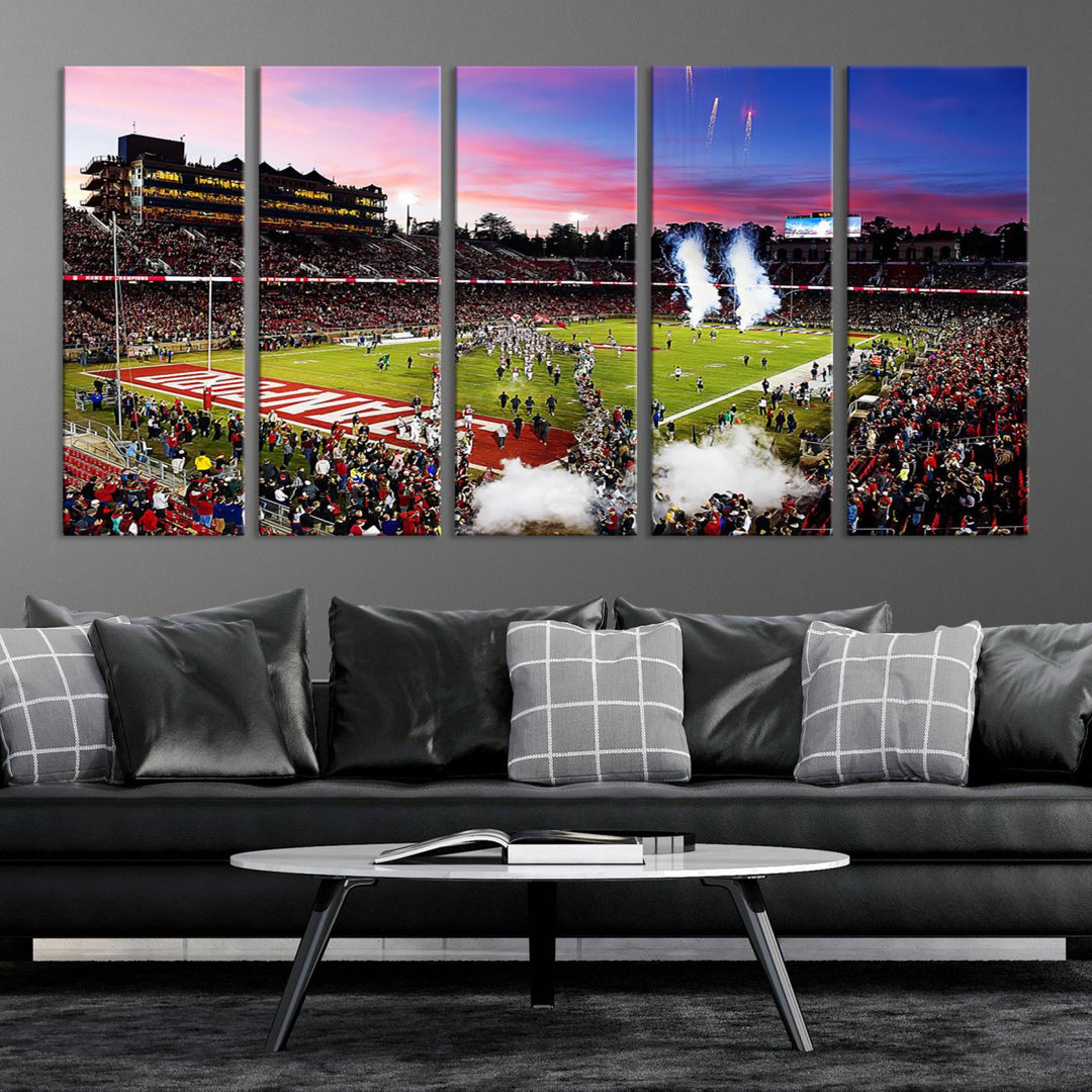 The wall art features a canvas print of the Stanford Cardinal football team, capturing players, fireworks, and smoke against the backdrop of a sunset at Stanford Stadium.