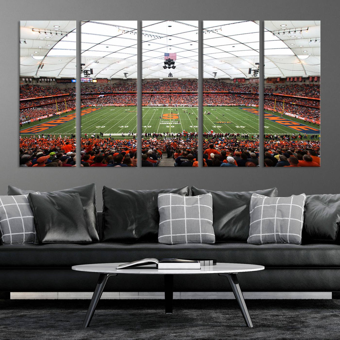 Fans fill the Syracuse JMA Wireless Dome, highlighted in orange and blue under a vaulted roof on this premium canvas print of the scene.