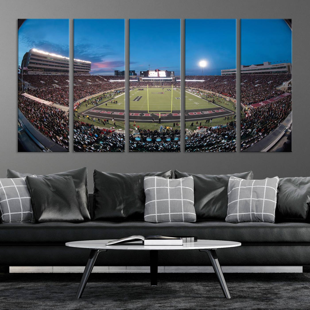 The wall art in the living room features a Texas Tech Red Raiders Football Team Print, showcasing Jones AT&T Stadium at dusk.