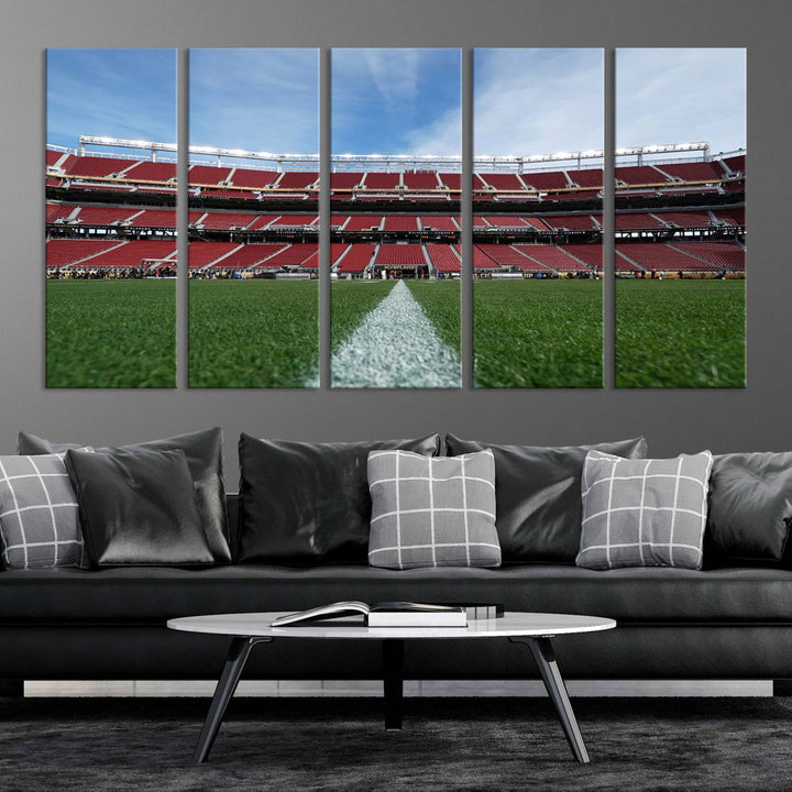 A canvas print of the University of Tulsa Golden Hurricane showcases H.A. Chapman Stadiums football field and red seats against a backdrop of a blue sky.