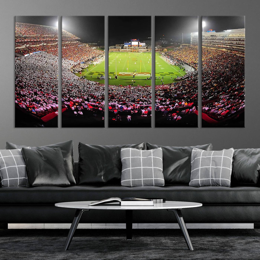 The Maryland Terrapins Football Wall Art Canvas showcases a packed SECU Stadium at night with a bright field and cheering fans.