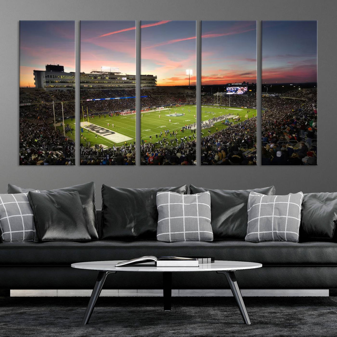 This wall art canvas print captures UCONN Huskies fans energizing a sunset scene at East Hartfords Pratt & Whitney Stadium.