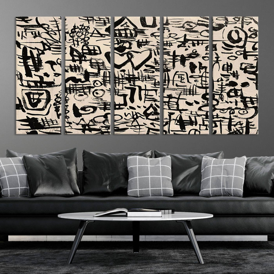 The Abstract Love and Chaos canvas is a museum-quality print featuring black symbols on a beige background, adorned with a heart and scribble design. It is framed to enhance its artistic appeal.