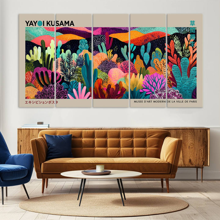 The framed Yayoi Kusama wall art adds vibrancy above the blue couch.