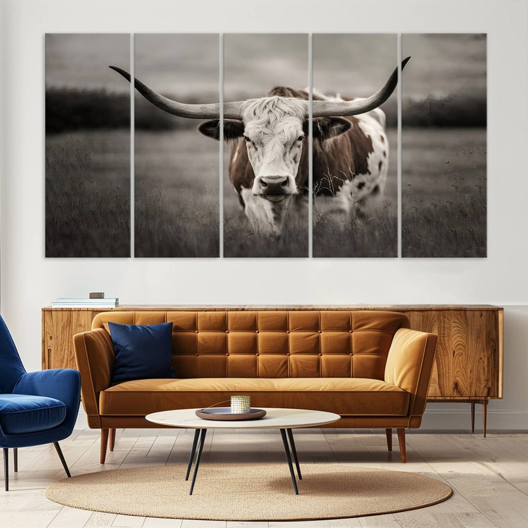 The Texas Longhorn Cow Canvas Wall Art Print adds a rustic touch to a living room.