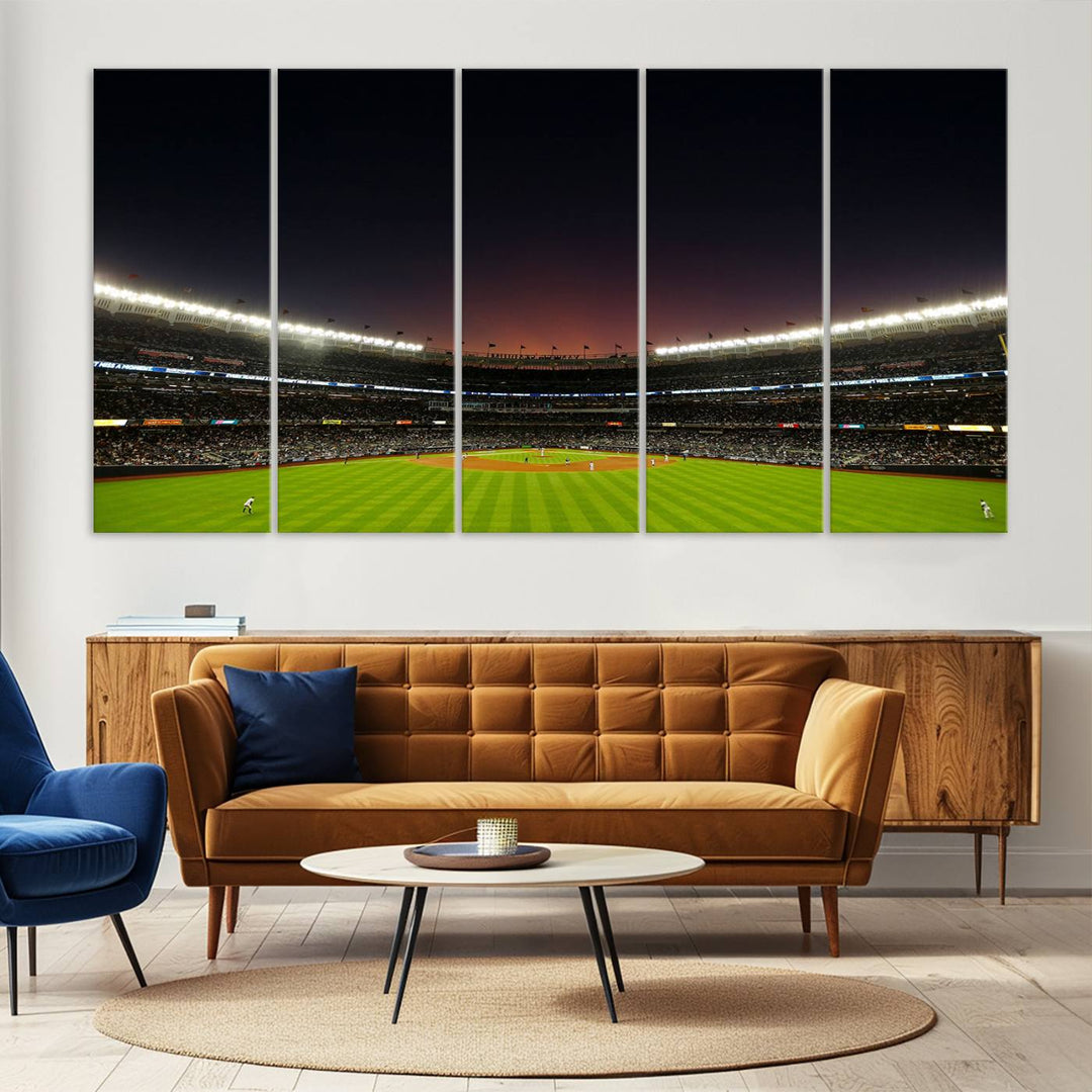 A night game at Yankee Stadium depicted on canvas beneath a sunset sky.