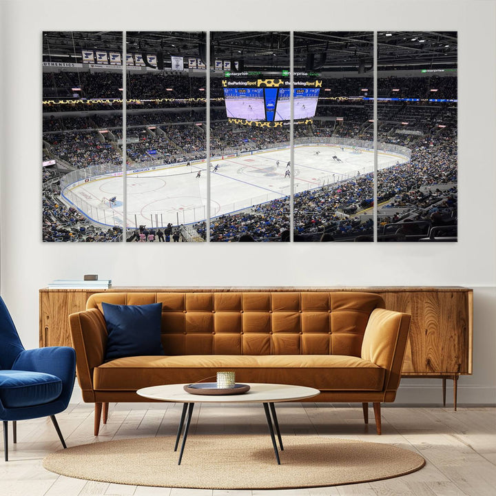 A large Enterprise Center canvas of a crowded hockey arena hangs prominently.