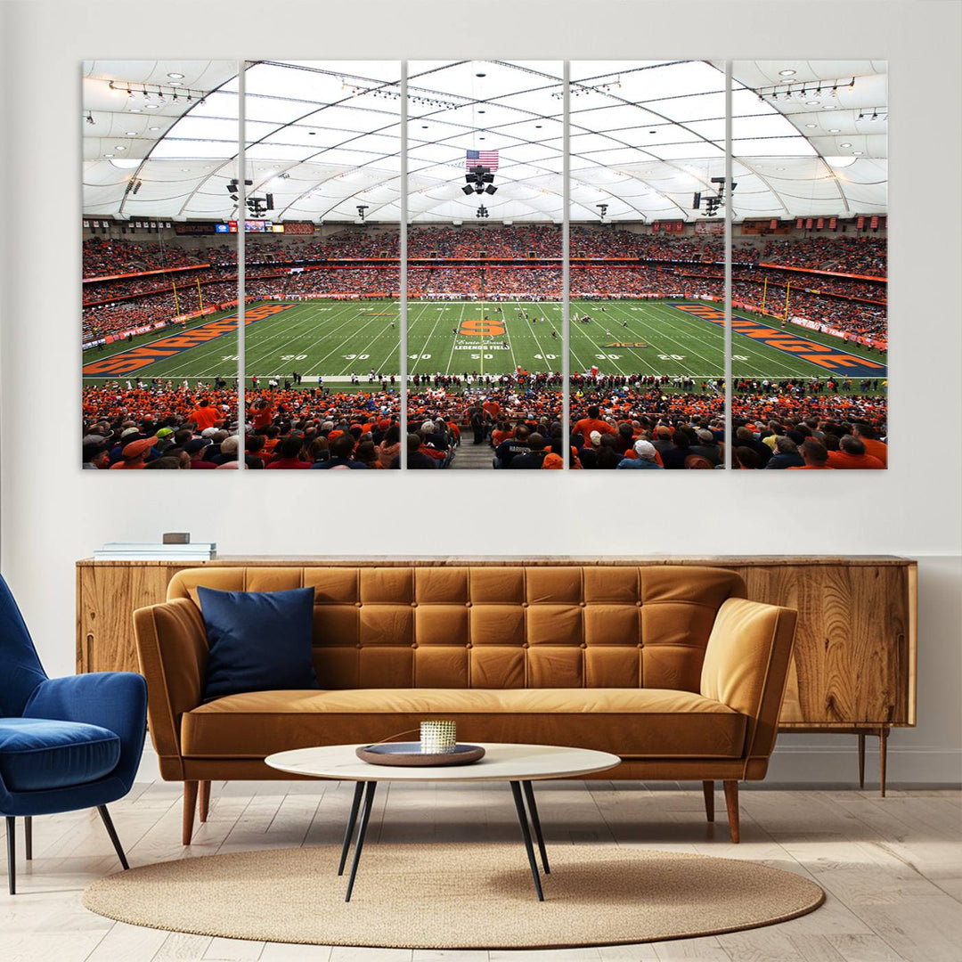 Fans fill the Syracuse JMA Wireless Dome, highlighted in orange and blue under a vaulted roof on this premium canvas print of the scene.