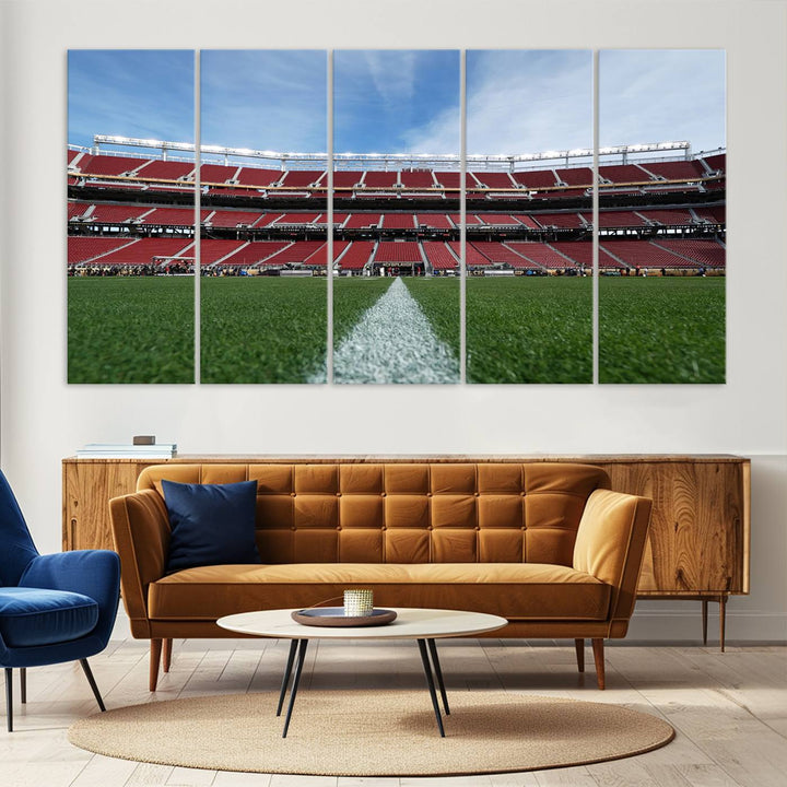 A canvas print of the University of Tulsa Golden Hurricane showcases H.A. Chapman Stadiums football field and red seats against a backdrop of a blue sky.