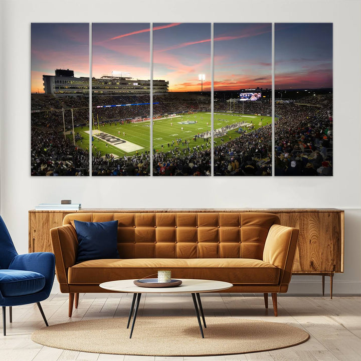 This wall art canvas print captures UCONN Huskies fans energizing a sunset scene at East Hartfords Pratt & Whitney Stadium.