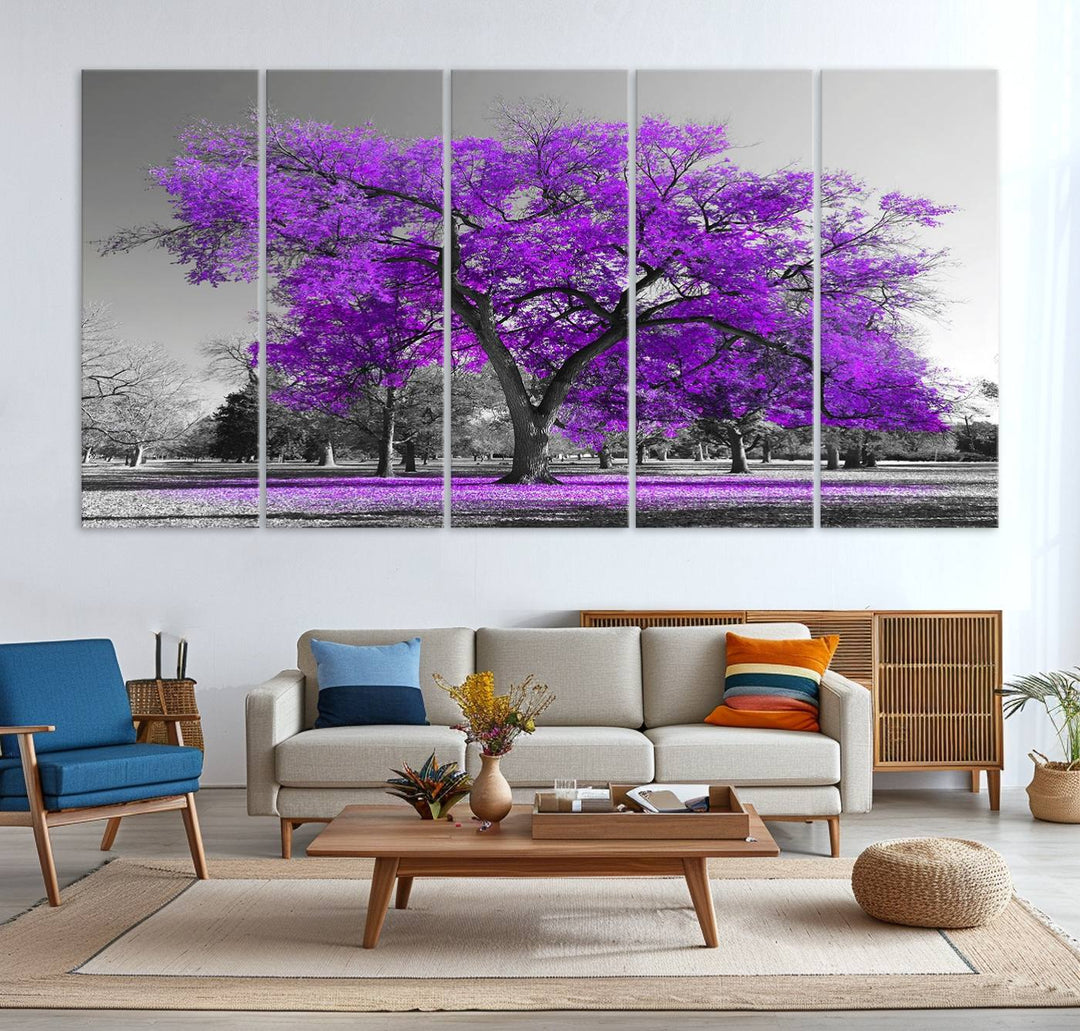 The Big Purple Tree Wall Art Canvas Print showcases a vibrant purple tree set against a black-and-white landscape.