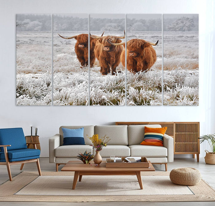 The Highland Cows in Snow canvas showcases three cattle in a frosty field.