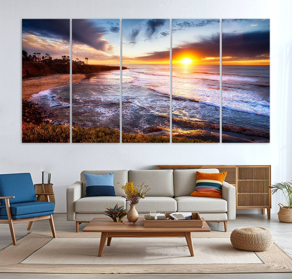 The California Coastline Sunset Canvas Art with waves adorns a wooden shelf.