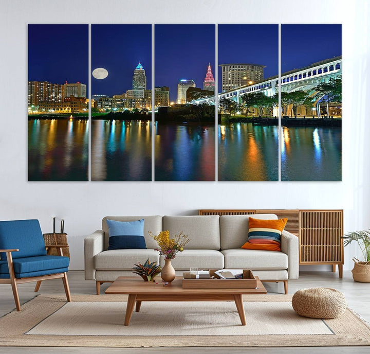 Cleveland City Lights Night Skyline Wall Art canvas showcases a moonlit cityscape reflected on water.