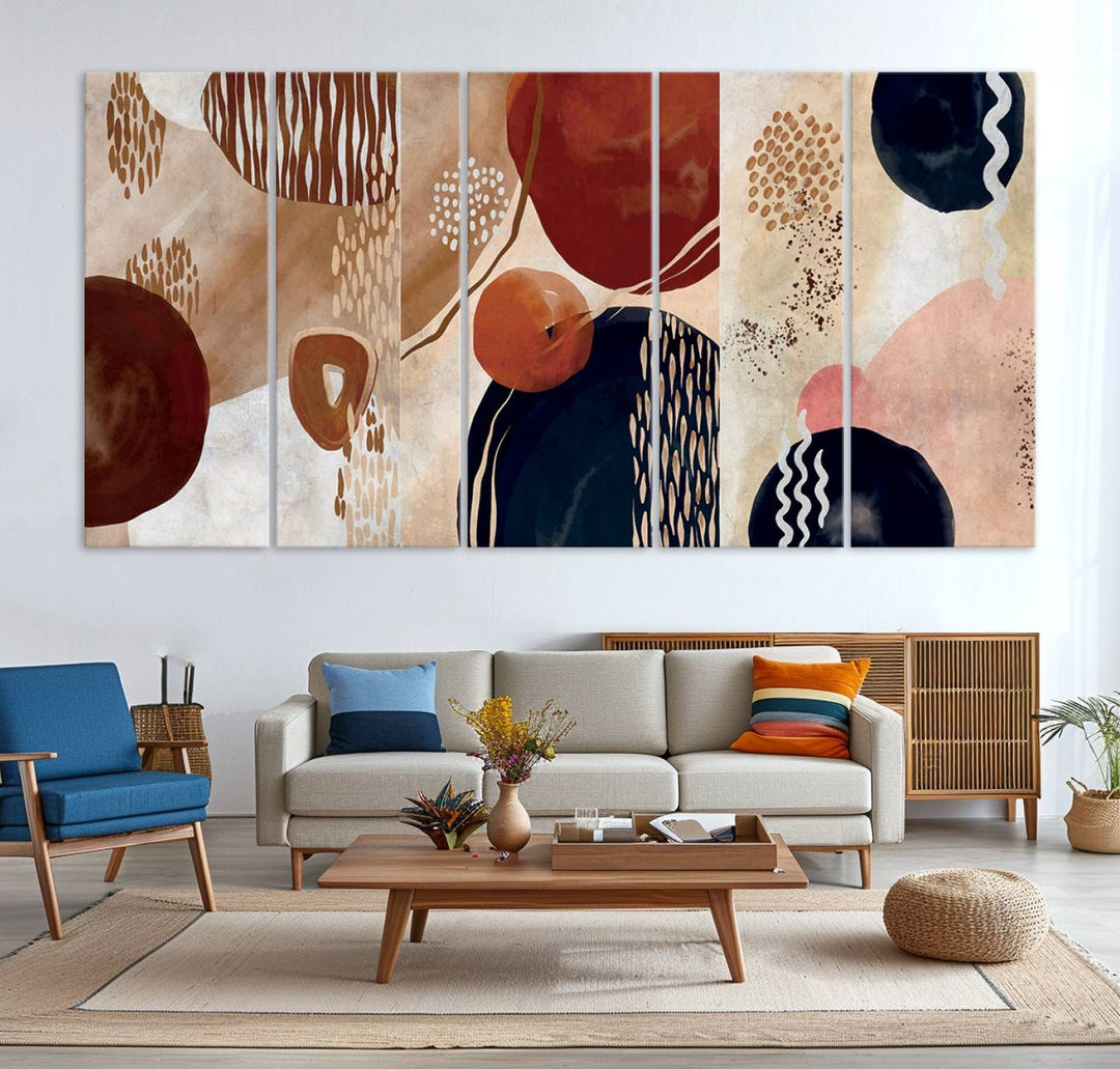 The Boho Neutral Canvas Print Set with earthy tones and circles hangs on the wall.