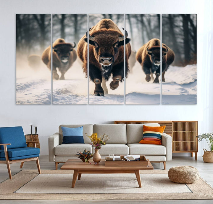 Wall art titled Cow Bighorn shows three bison running through snow in a forest.