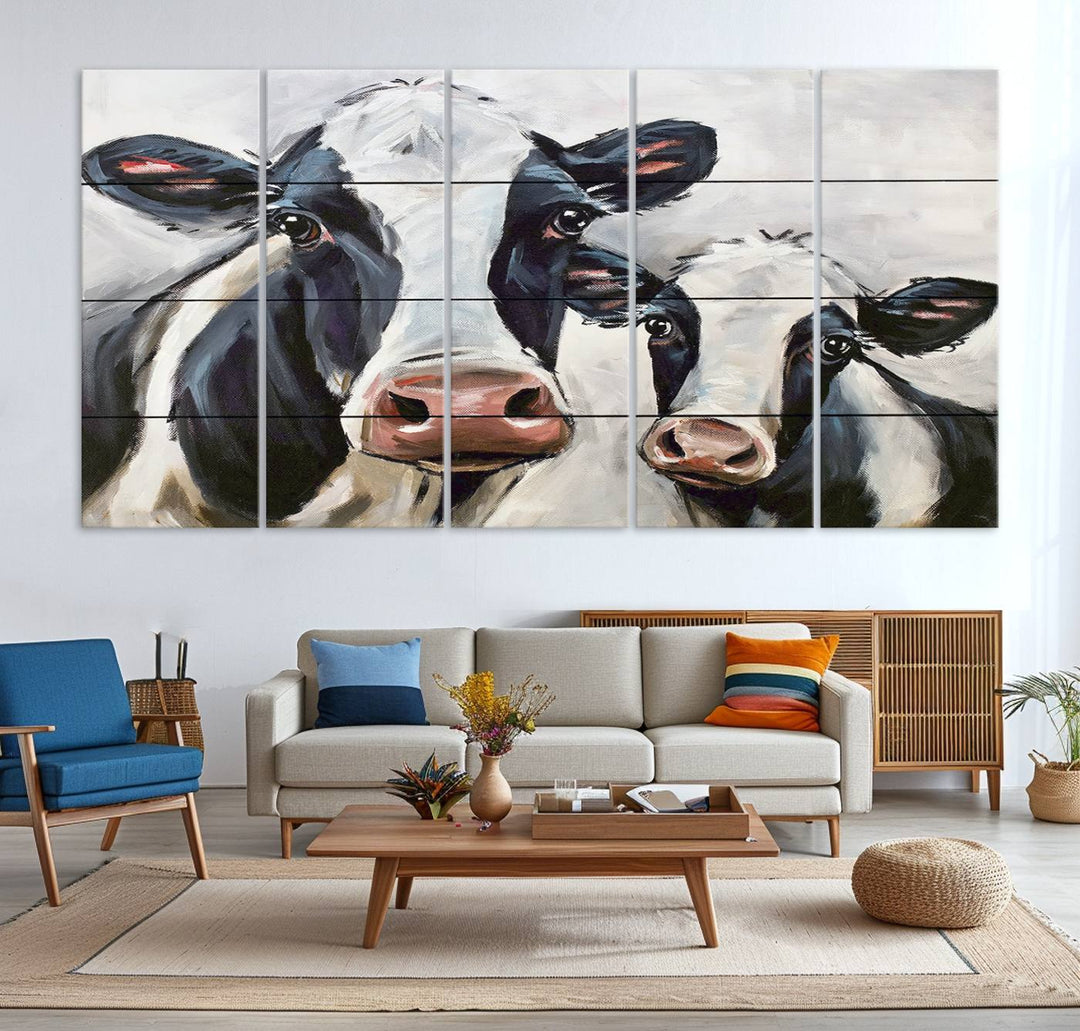 The Vintage Baby and Mom Cattle Canvas, featuring cows with black and white patches, is a prominent piece of wall art.