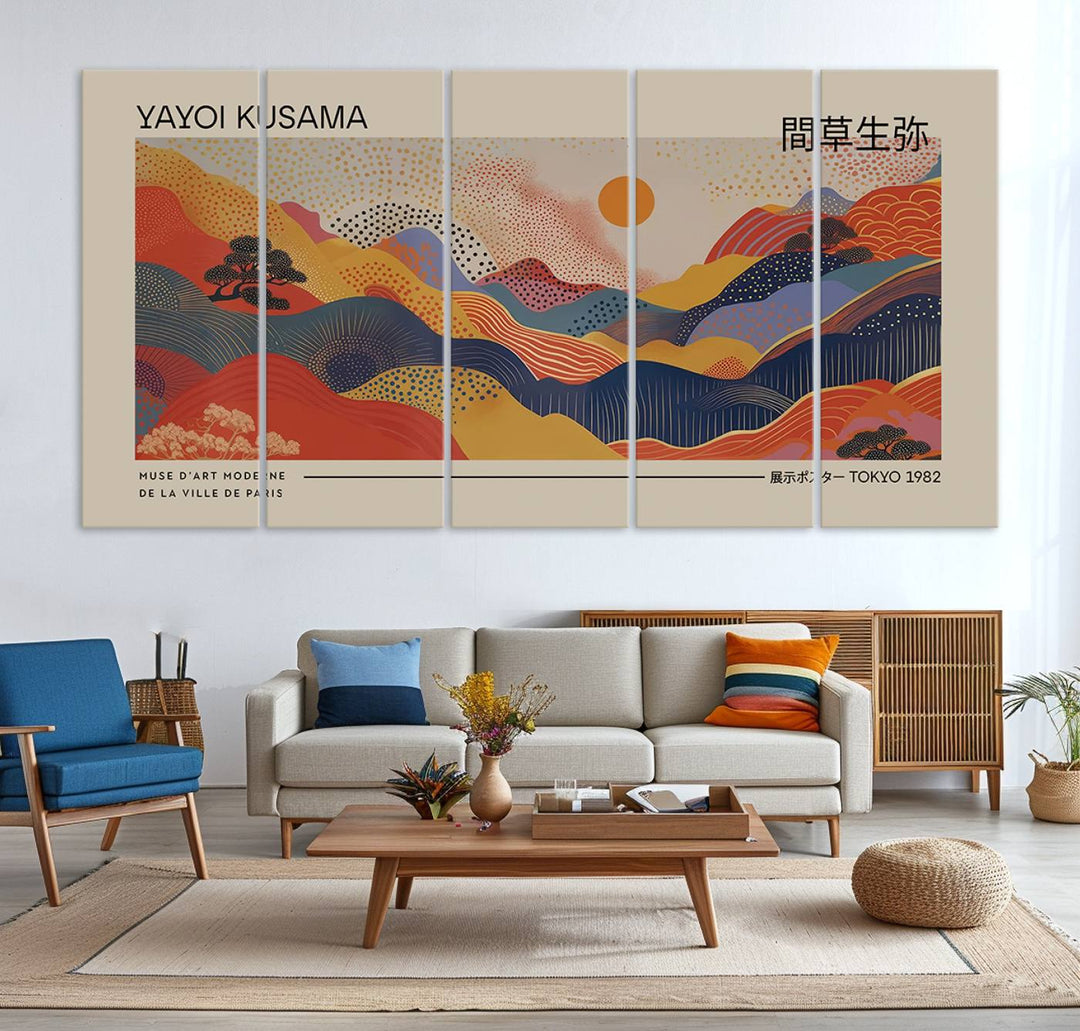 The Yayoi Kusama vibrant landscape canvas print featuring abstract mountains and a sun enhances the space with its modern aesthetic.