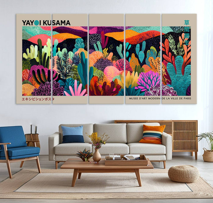 The framed Yayoi Kusama wall art adds vibrancy above the blue couch.