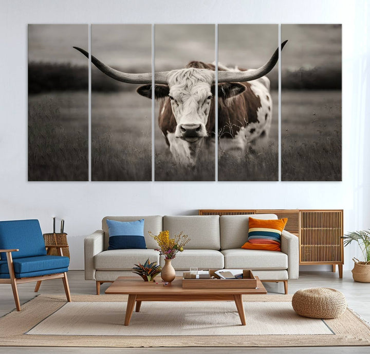 The Texas Longhorn Cow Canvas Wall Art Print adds a rustic touch to a living room.