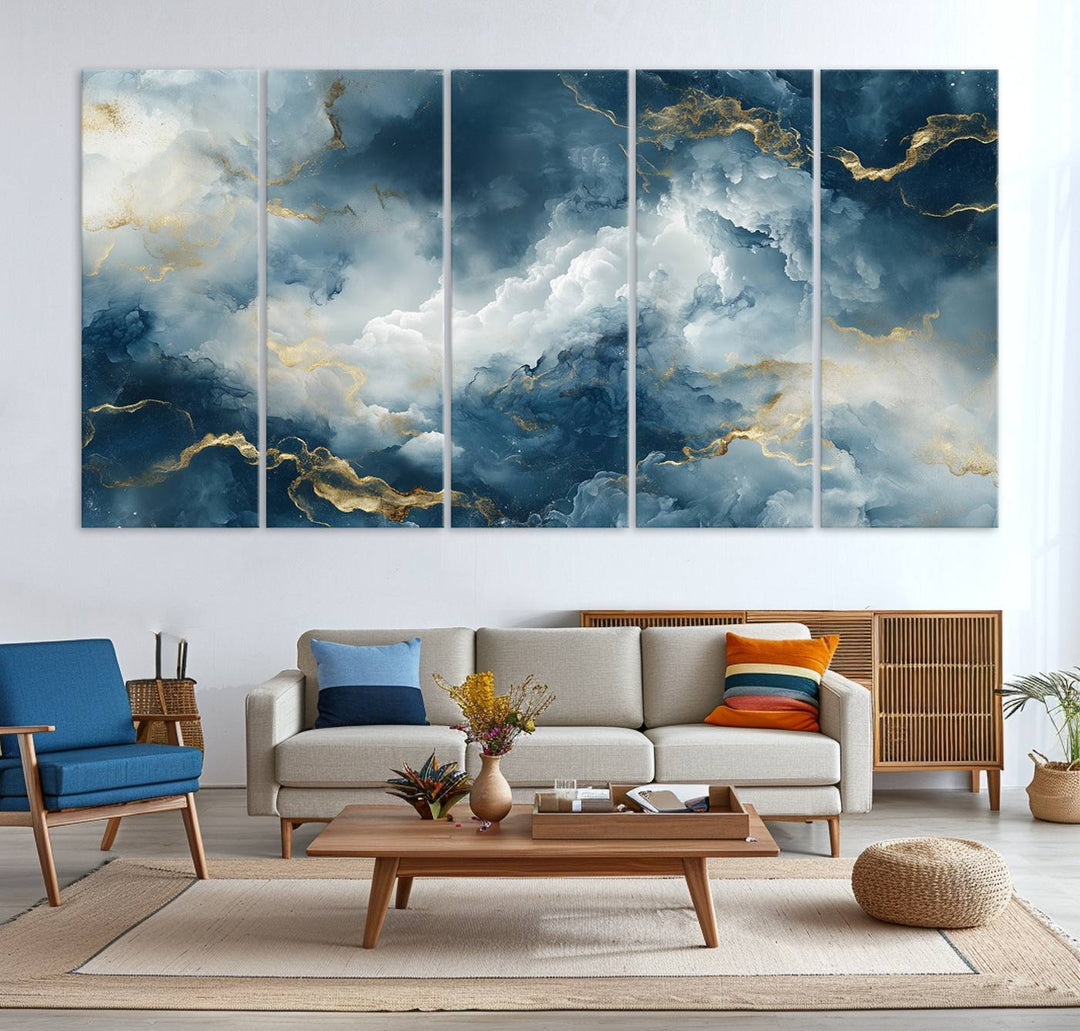 Modern living room featuring the Large Abstract Print - Luxe Blue and Gold Abstract Canvas Wall Art that showcases a bold cloudscape, perfect for modern home decor.